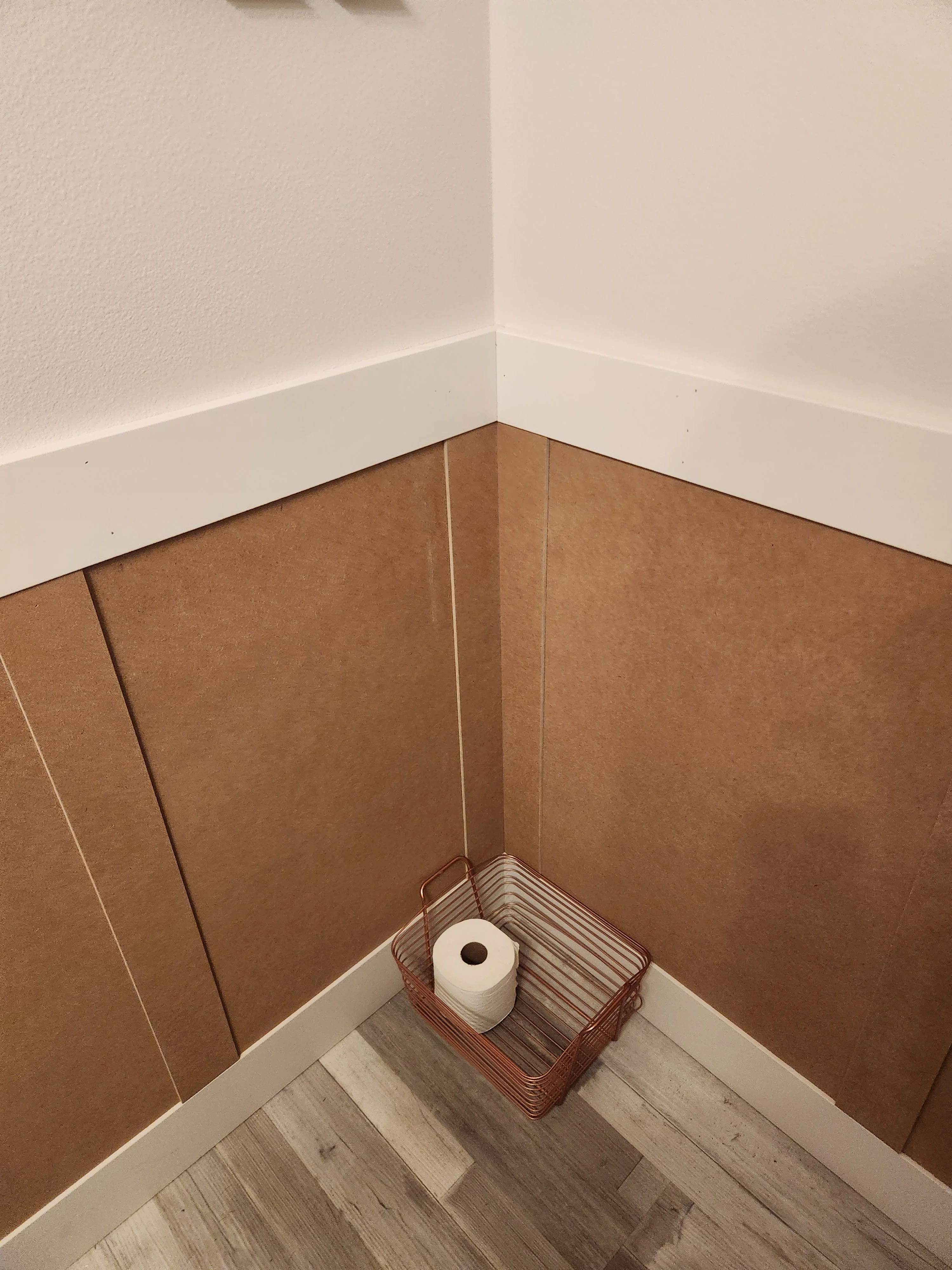 Bathroom wall panel and floor finish detail