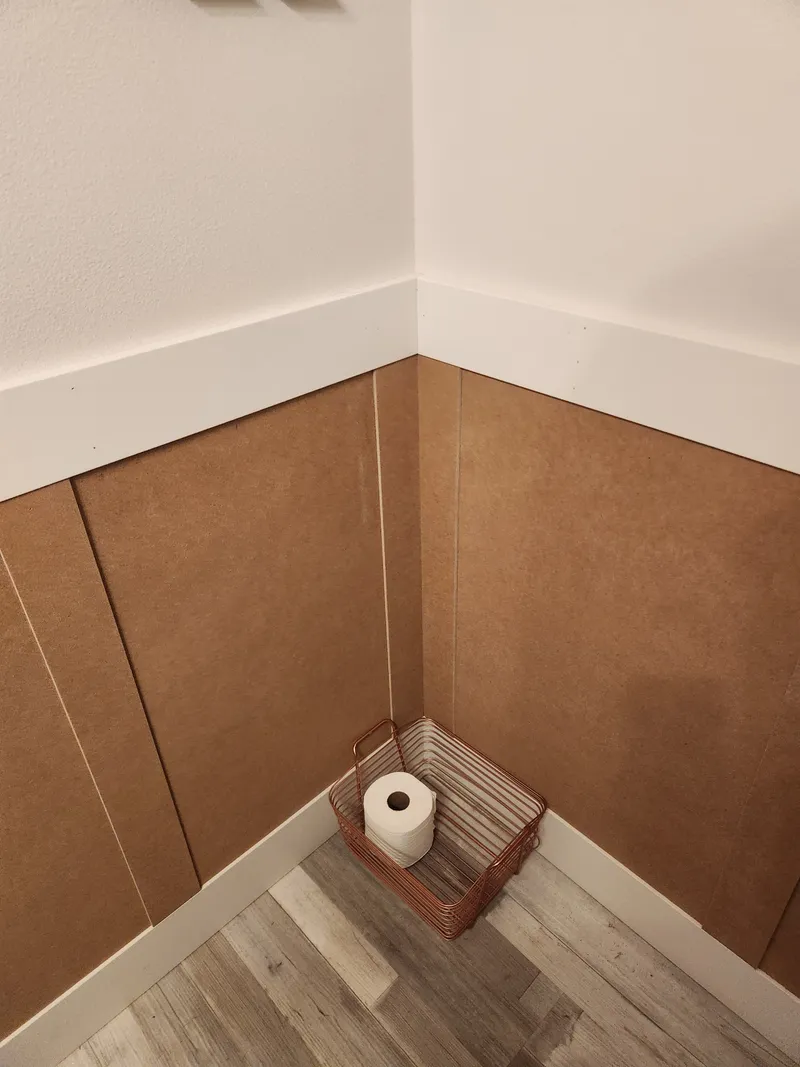 Wall panel from the existing bathroom-refresh project, shown as related finish work