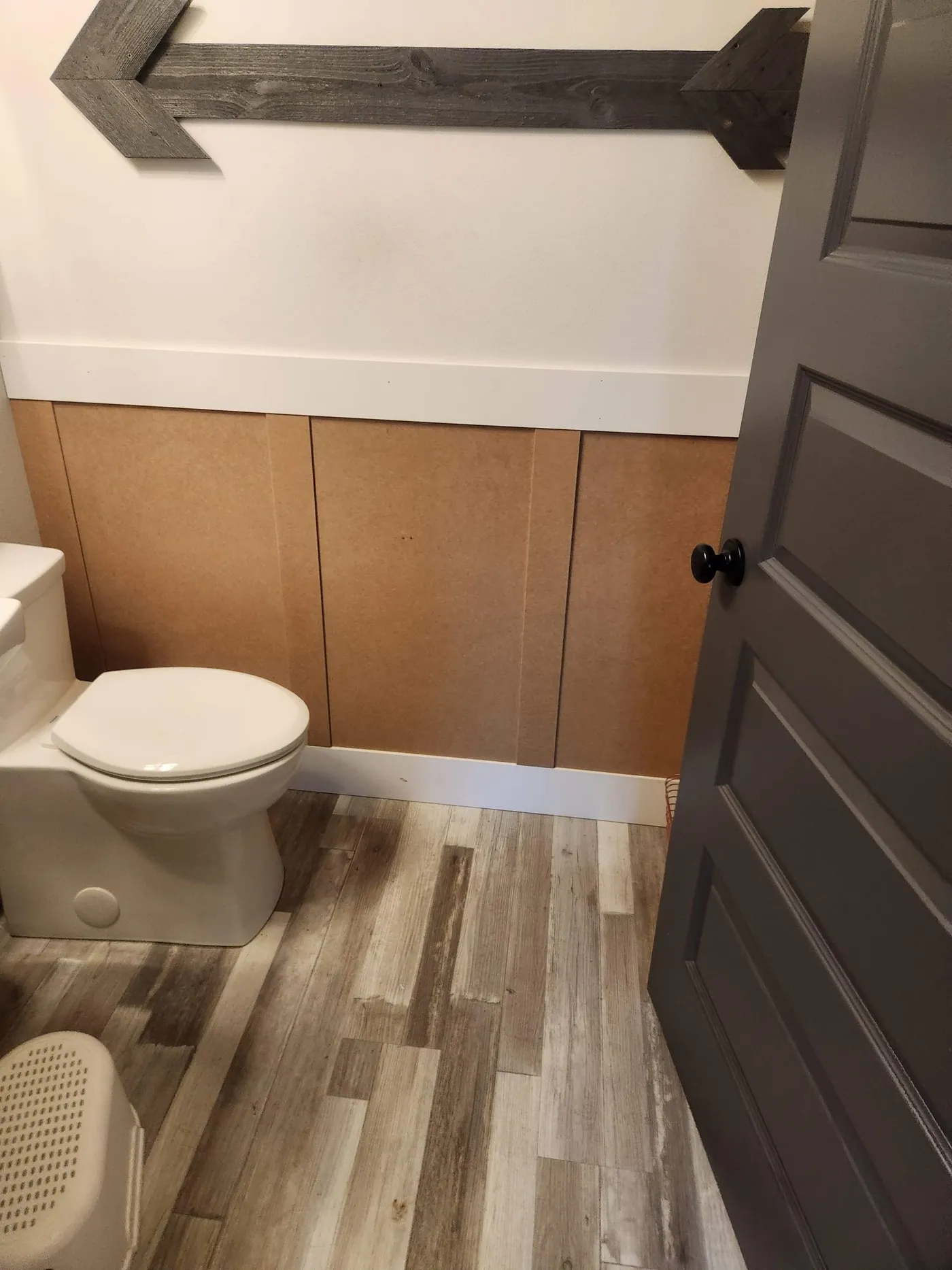 Bathroom wainscoting during a unit turnover