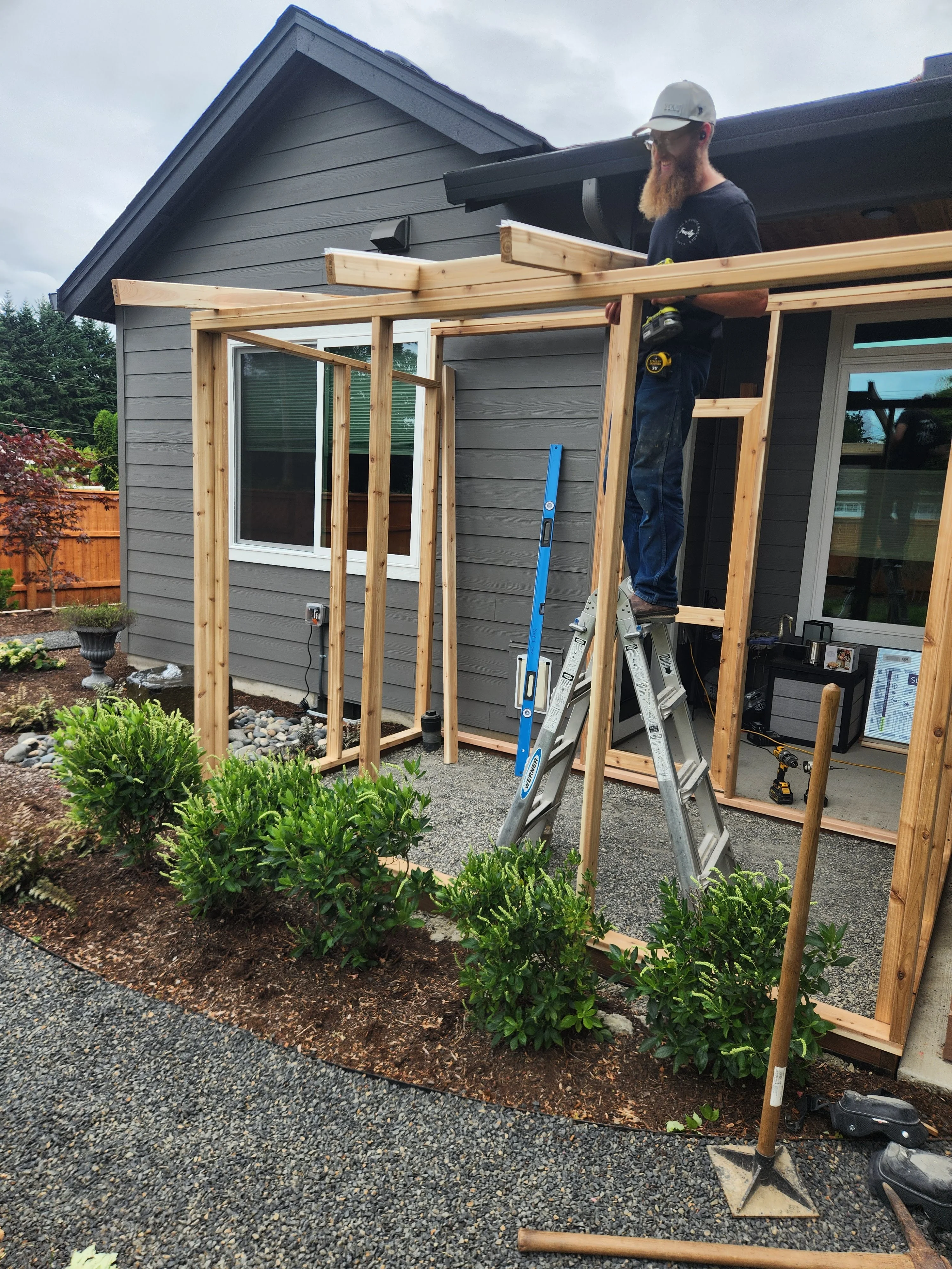 Outdoor framing work for a custom patio enclosure