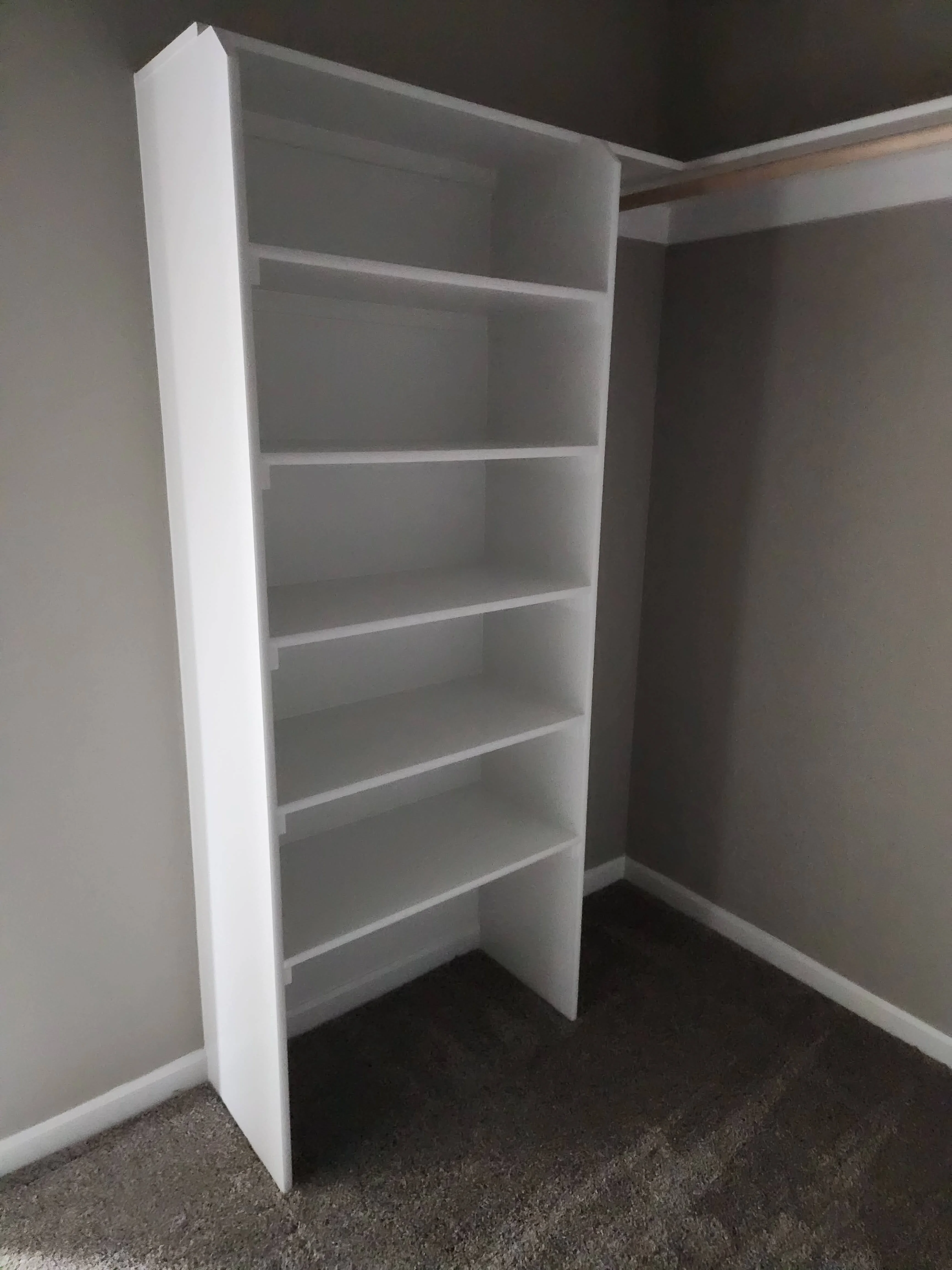 Closet shelving built into a small room