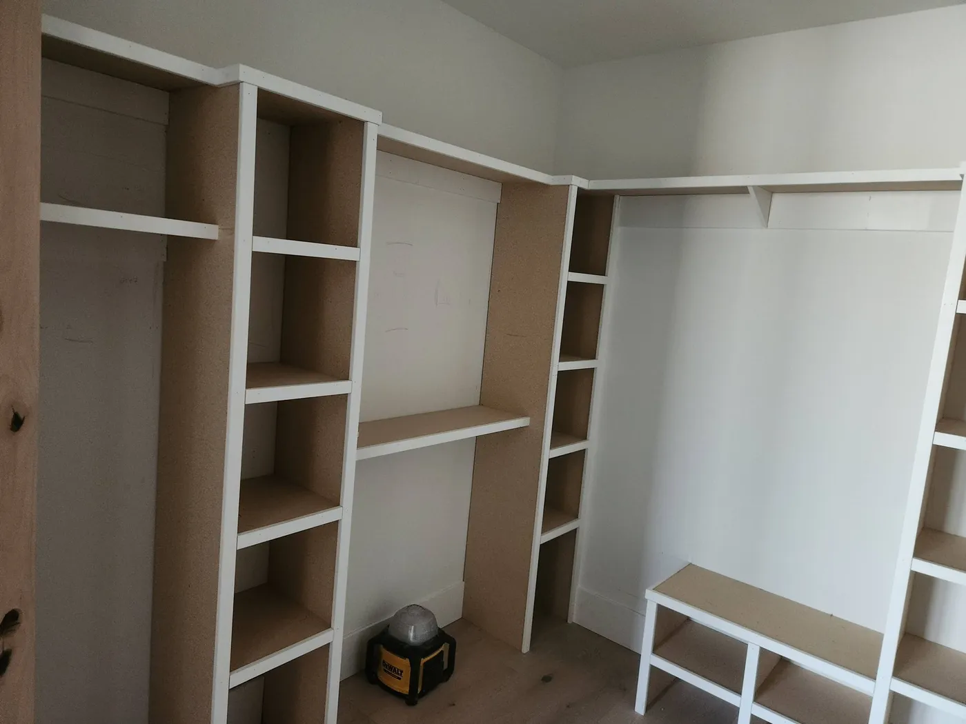 Closet shelving system being built