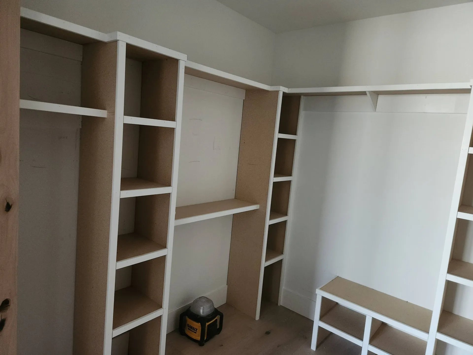 Closet shelving system being built