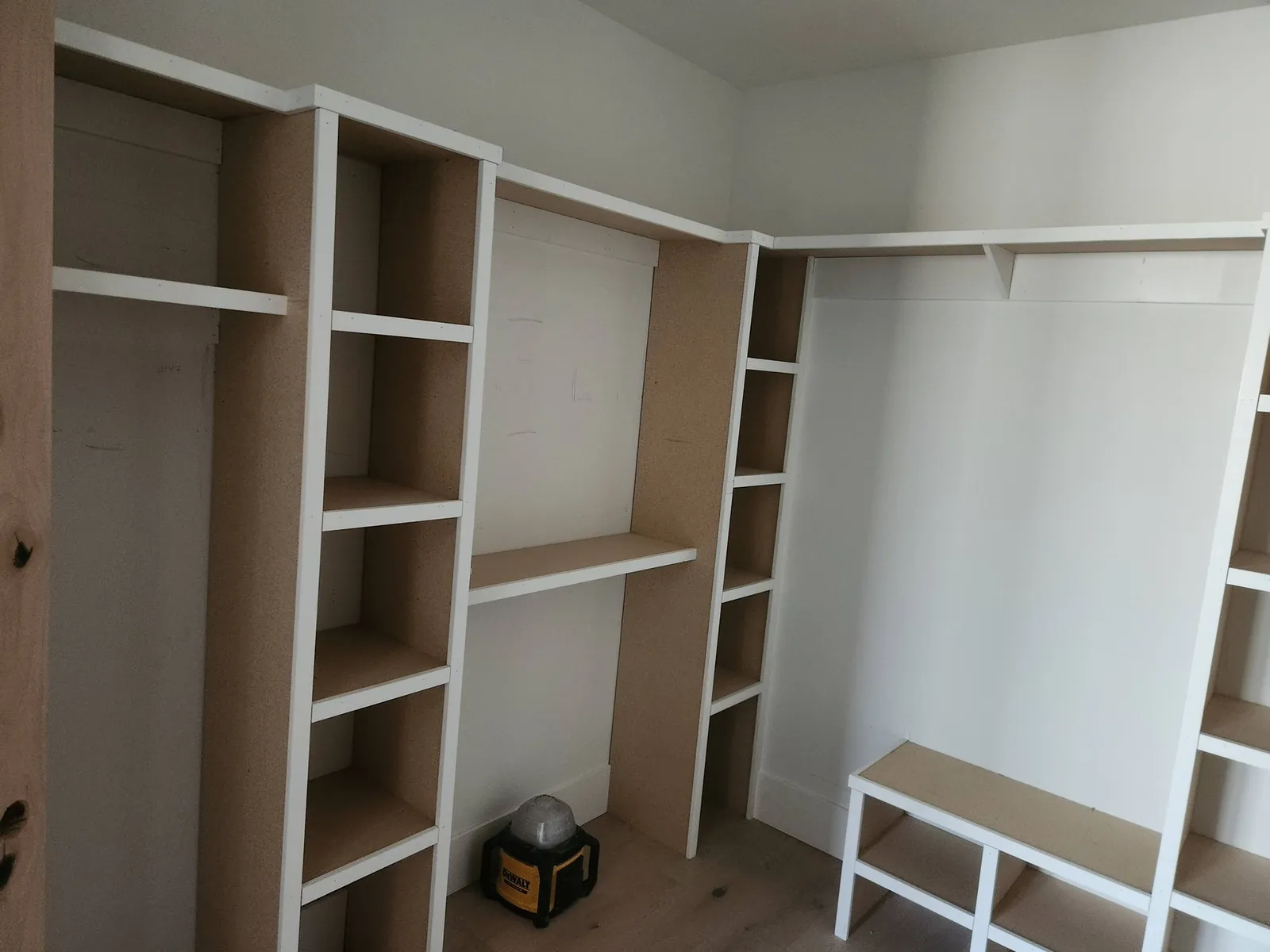Closet shelving system being built