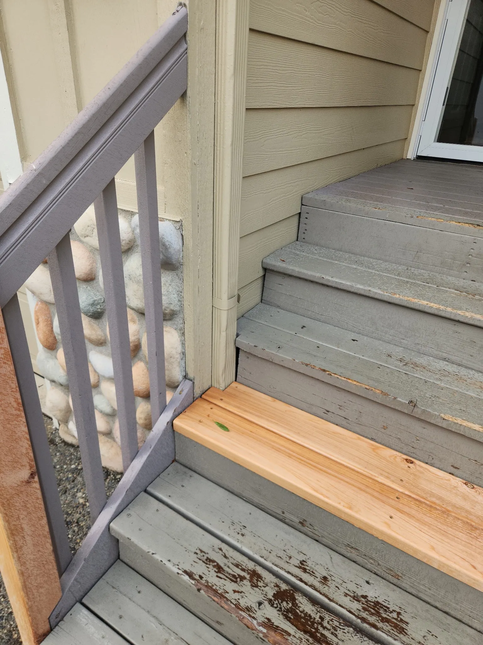 Front steps with a new wood tread