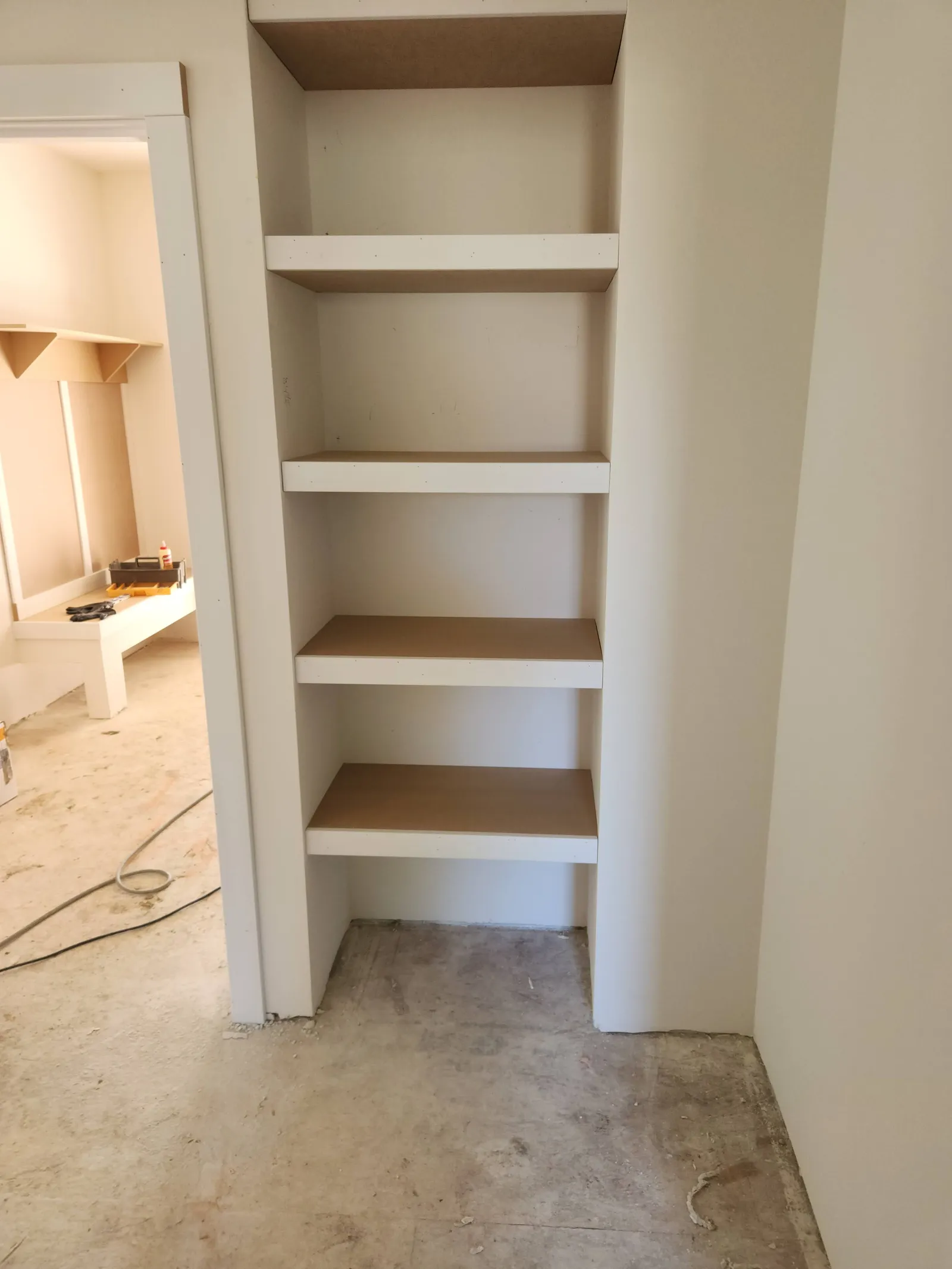 Shelves built into a recessed pantry opening