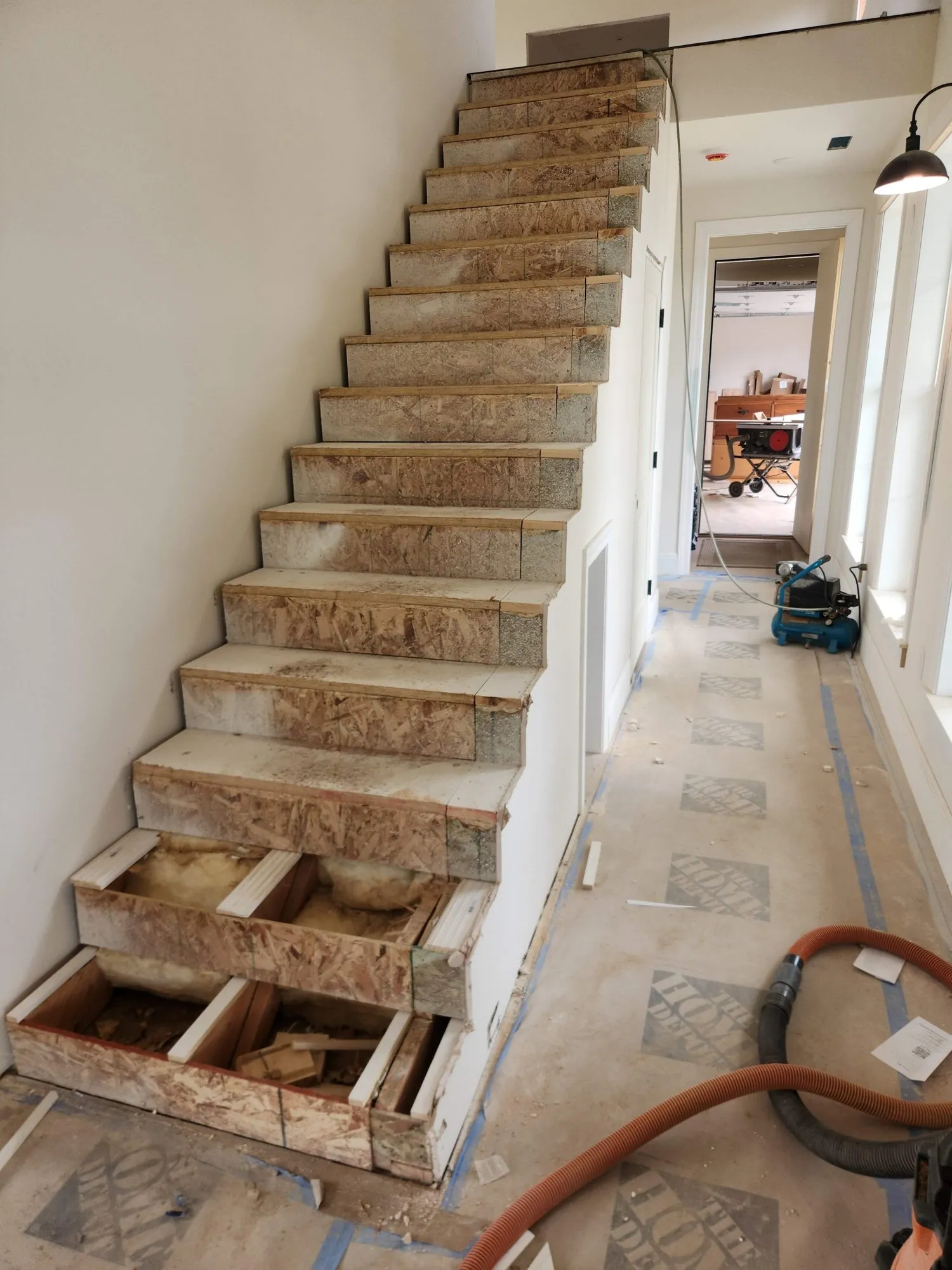 Rough-framed staircase before the remodel