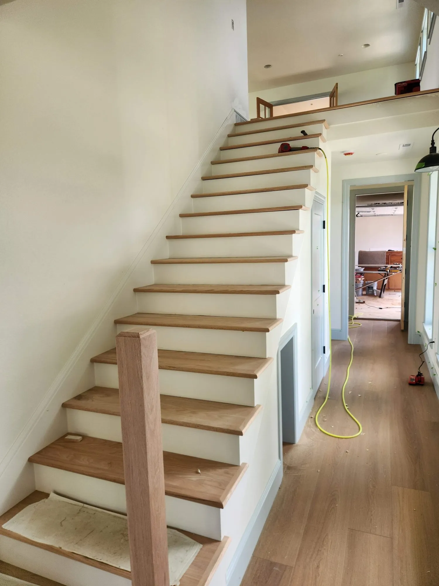 Oak treads being installed on a staircase
