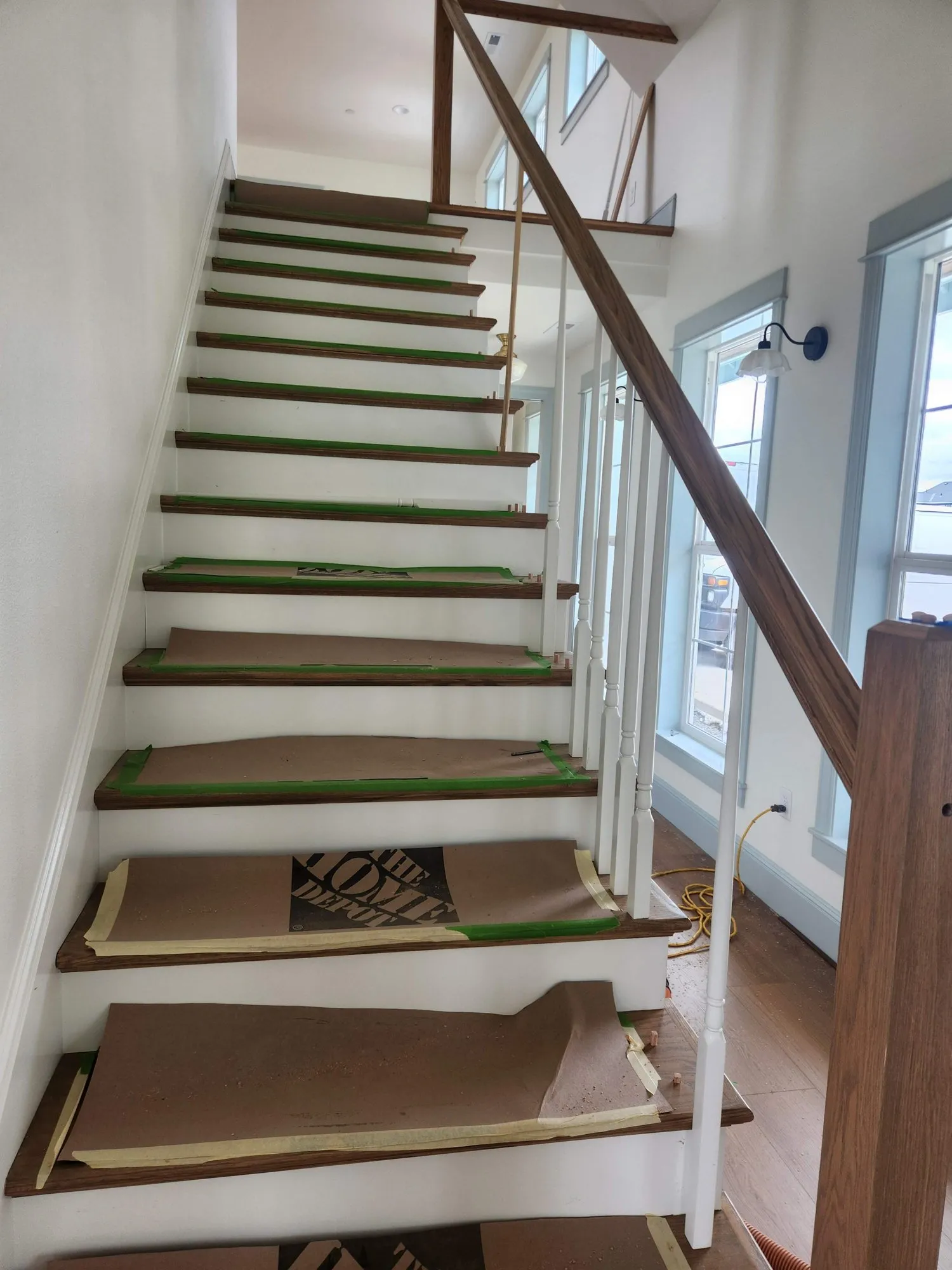 Oak handrail and white balusters on new oak treads