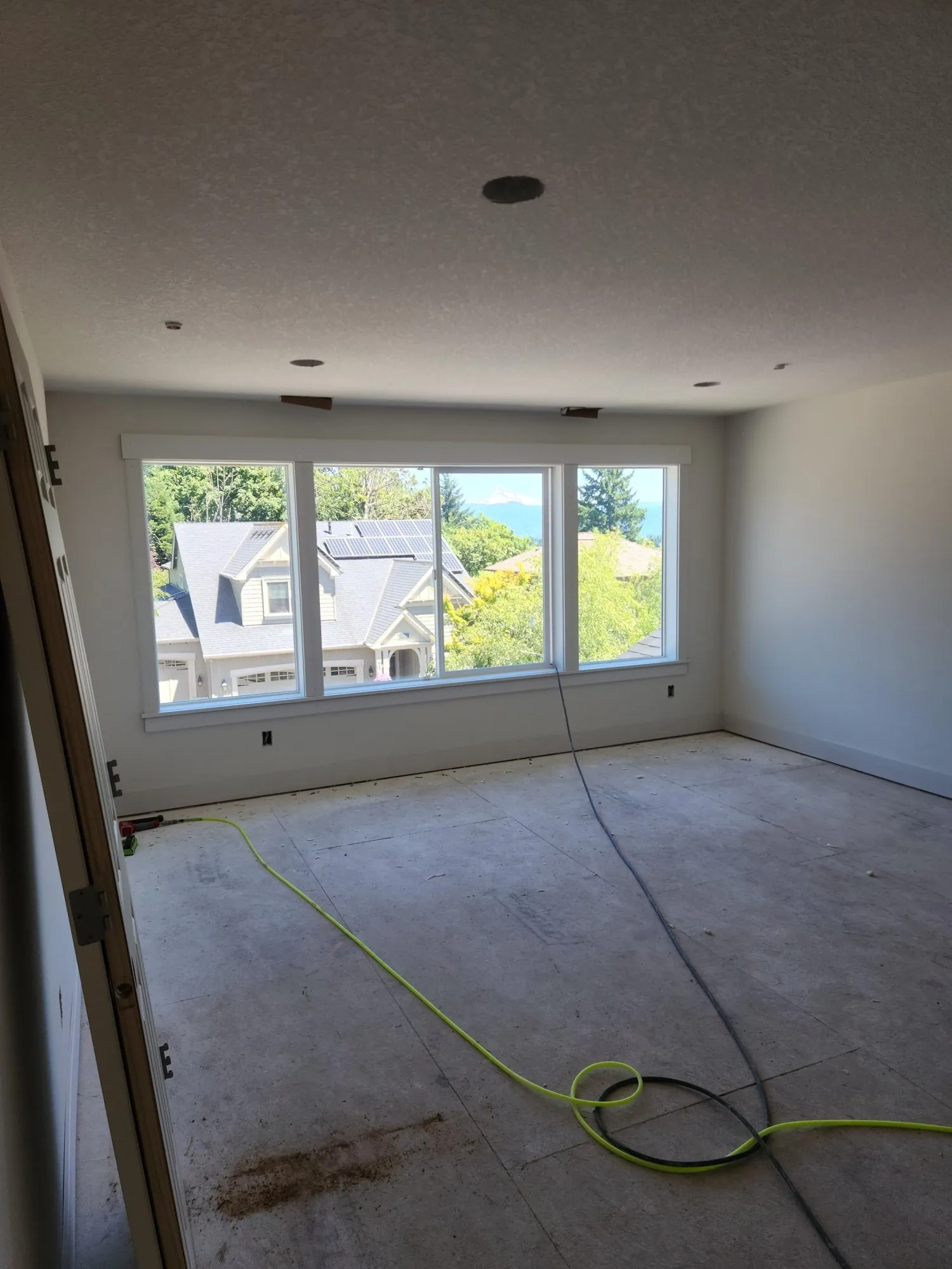 Triple picture window with new casing, stool, and apron