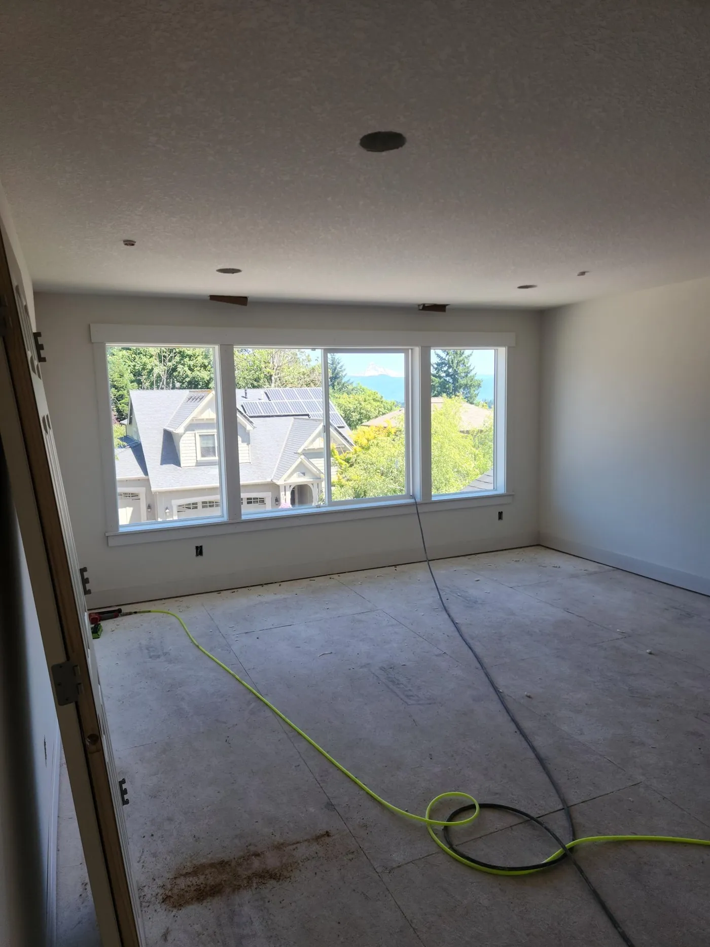 Triple picture window with new casing, stool, and apron